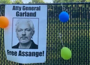 Supporters of Julian Assange gather outside Merrick Garland’s house to call for the dismissal of the charges.