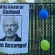 Supporters of Julian Assange gather outside Merrick Garland’s house to call for the dismissal of the charges.