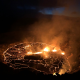 Hawaii’s Kilauea volcano spews lava fountains while a lagoon of molten rock illuminates the night.