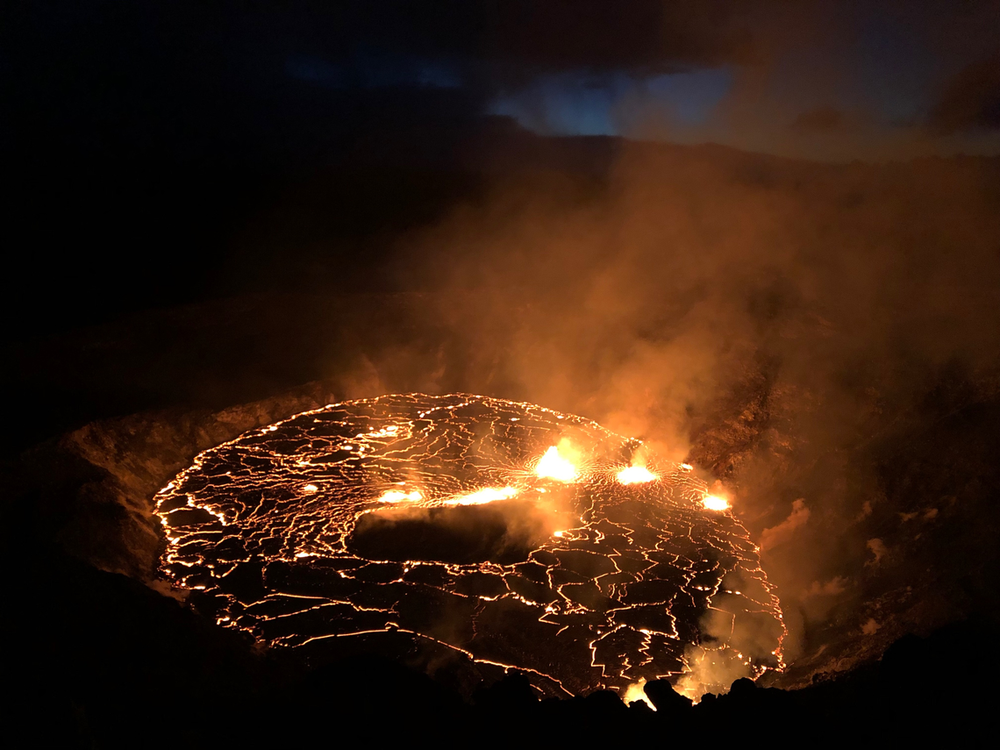 Hawaii’s Kilauea volcano spews lava fountains while a lagoon of molten rock illuminates the night.